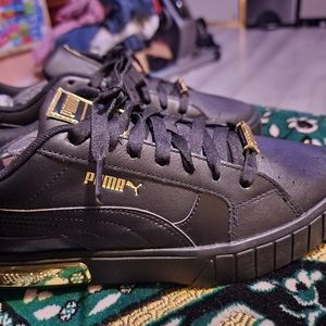 Puma cali star black and gold size 9